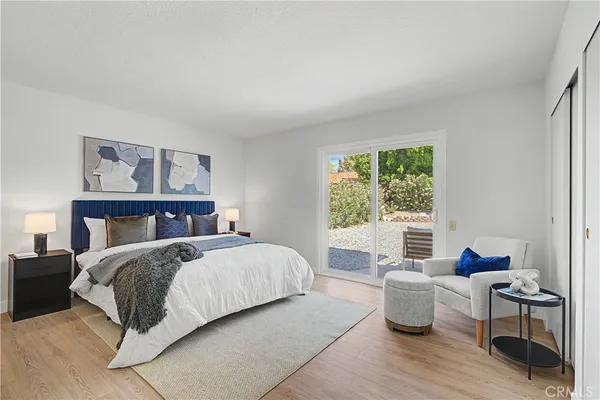 a bedroom with a bed and a couch