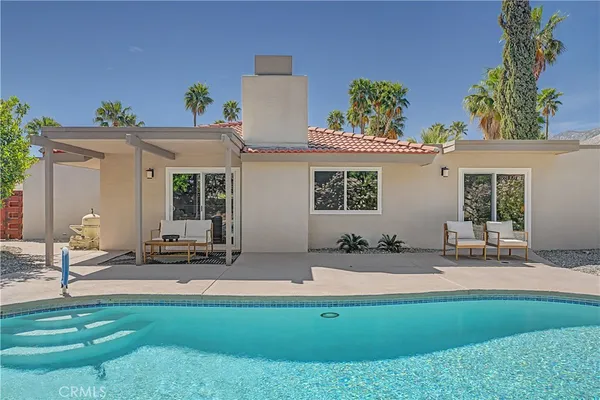 swimming pool view with a outdoor space