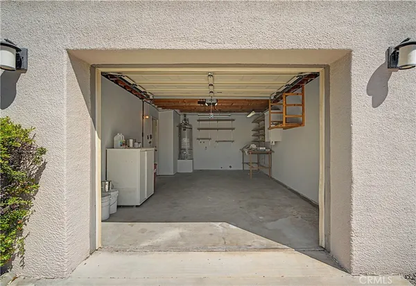 an aerial view of residential houses with outdoor space and ocean view
