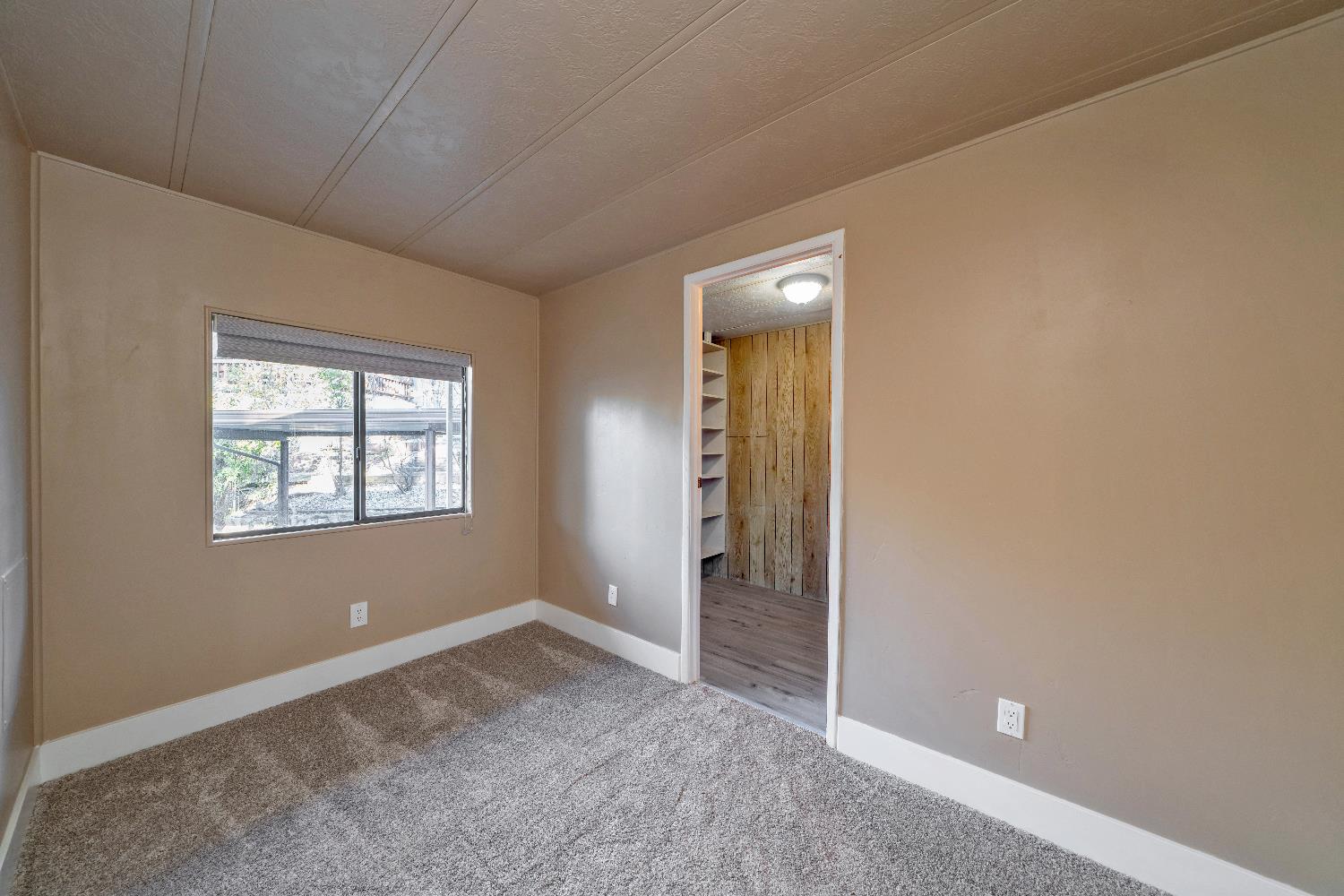 4420 Pleasant Valley Road, Unit 155 Diamond Springs, CA 95619 - Photo 30 of 42 an empty room with windows and closet