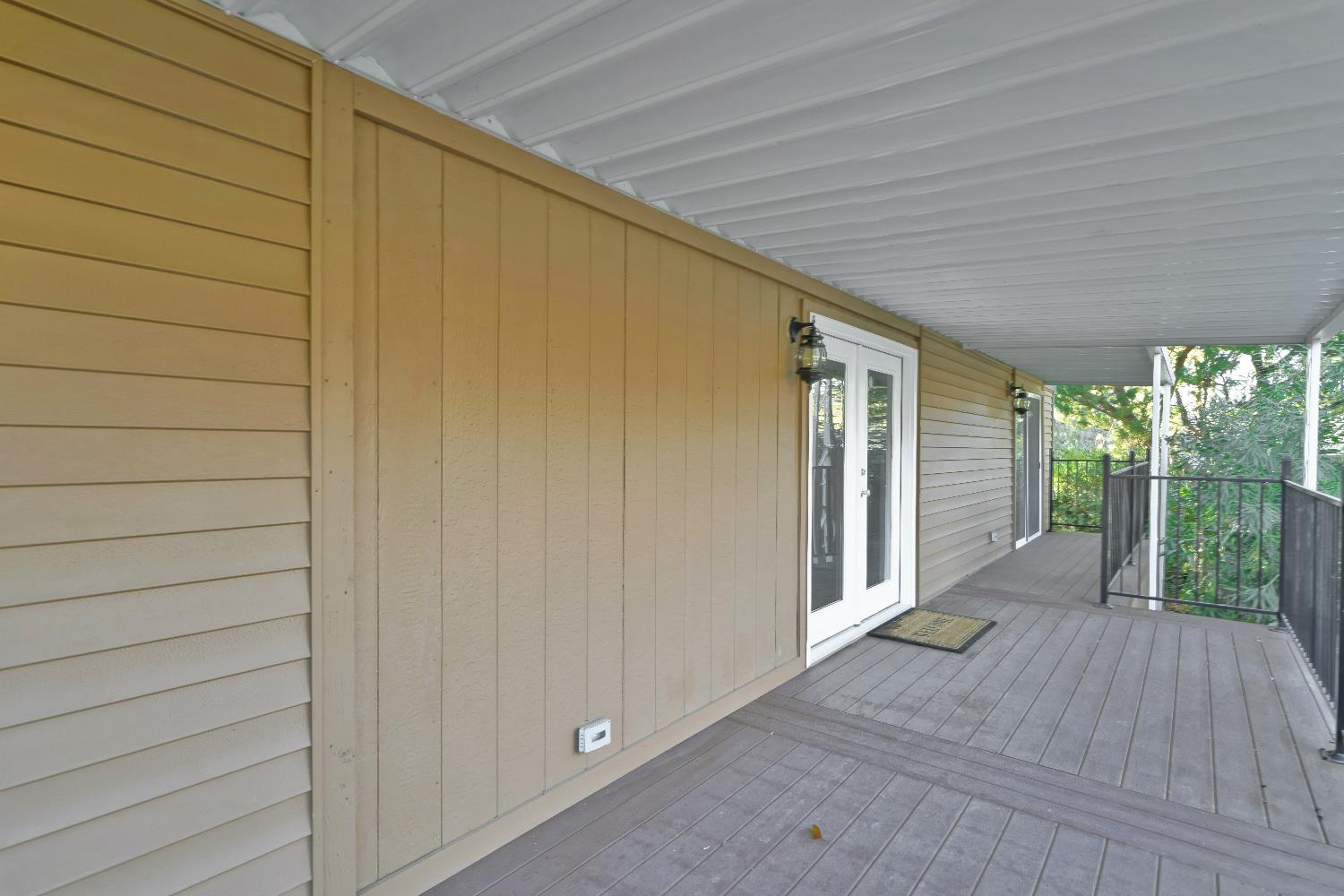 4420 Pleasant Valley Road, Unit 155 Diamond Springs, CA 95619 - Photo 6 of 42 a view of a house with porch and wooden floor