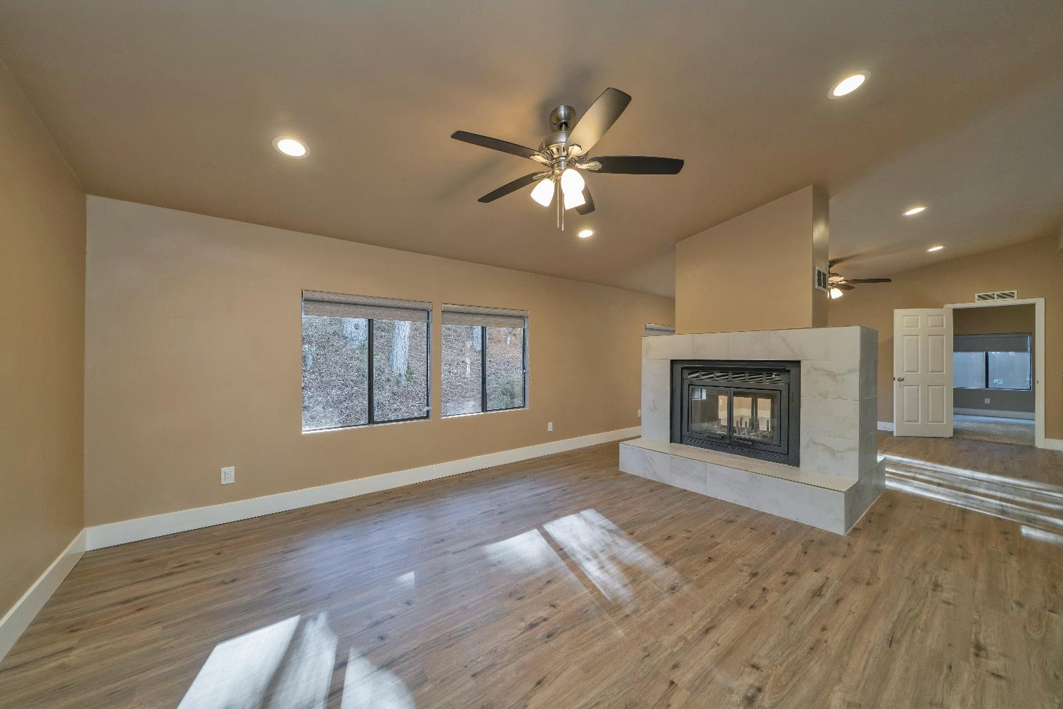 4420 Pleasant Valley Road, Unit 155 Diamond Springs, CA 95619 - Photo 9 of 42 a view of empty room with wooden floor and fan