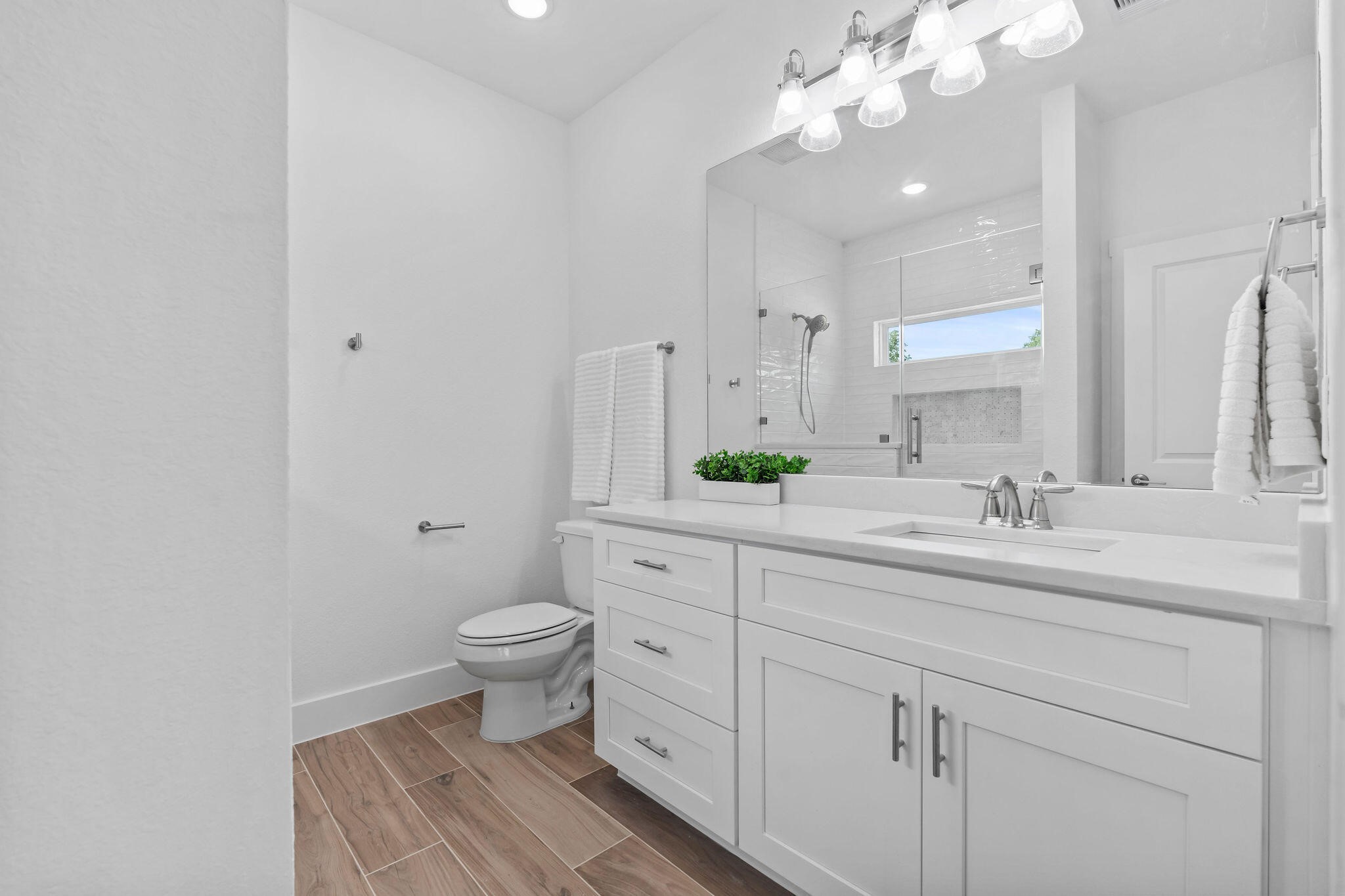 39645 Bosque Road Hempstead, TX 77445 - Photo 12 of 37 a bathroom with a toilet sink and mirror