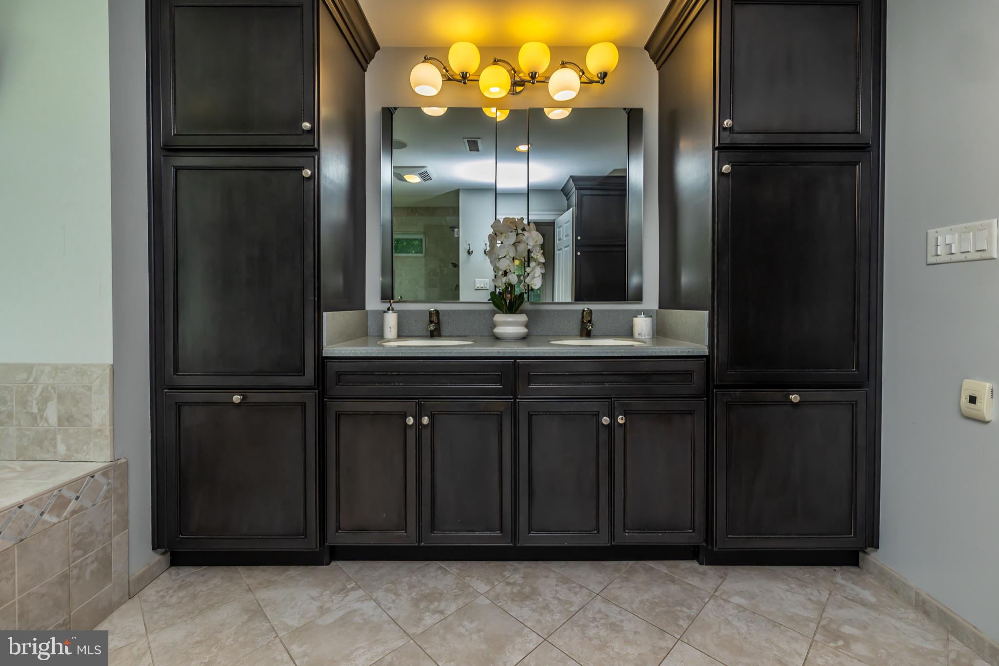 146 Logtown Road Media, PA 19063 - Photo 61 of 128 Elegant bathroom with dark cabinetry.