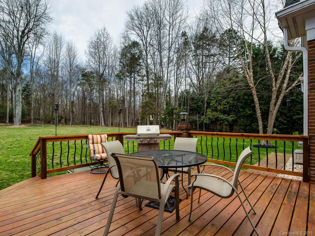 3402 Gray Moss Road Charlotte, NC 28270 - Photo 22 of 24 a view of a deck with furniture and trees around