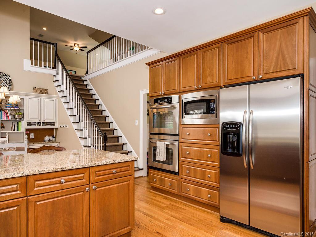 3402 Gray Moss Road Charlotte, NC 28270 - Photo 8 of 24 a kitchen with granite countertop stainless steel appliances and wooden cabinets