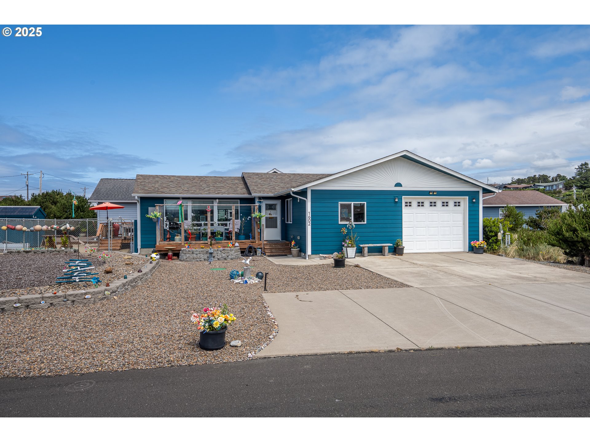 1602 Northwest Oceanic Loop Waldport, OR 97394 - Photo 2 of 47 a house view with a sitting space and garden space