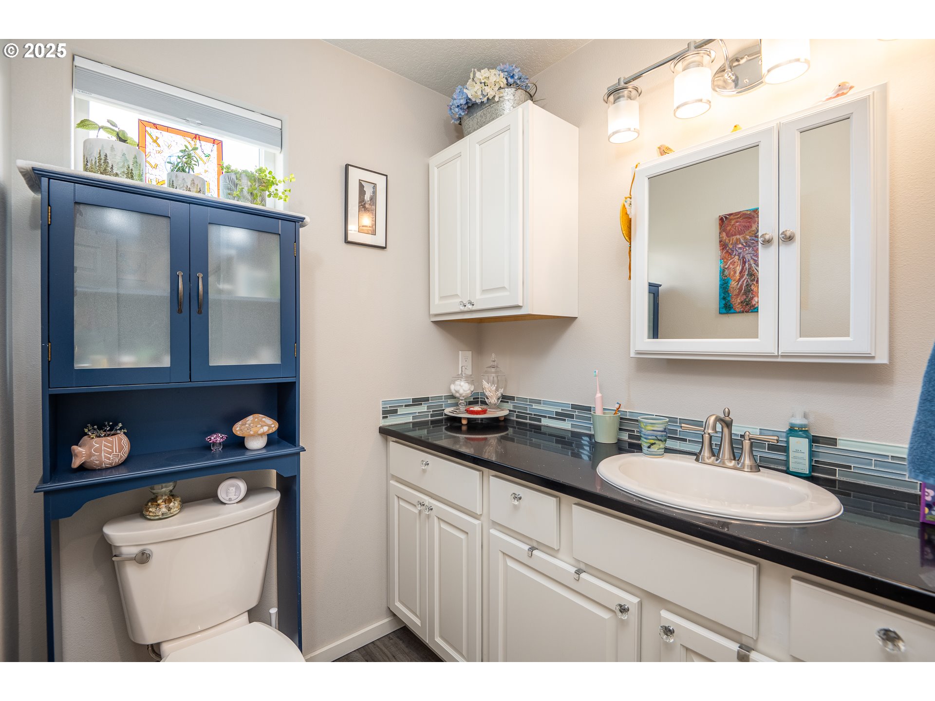 1602 Northwest Oceanic Loop Waldport, OR 97394 - Photo 23 of 47 a kitchen with stainless steel appliances granite countertop a sink stove and cabinets