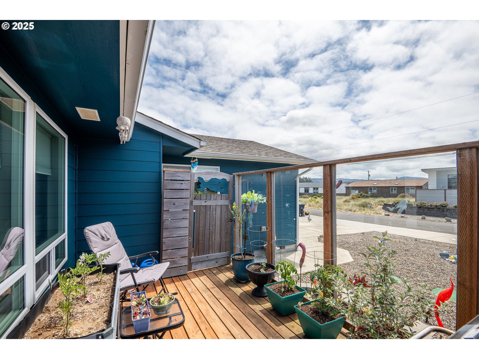 1602 Northwest Oceanic Loop Waldport, OR 97394 - Photo 28 of 47 a balcony with chairs and potted plants
