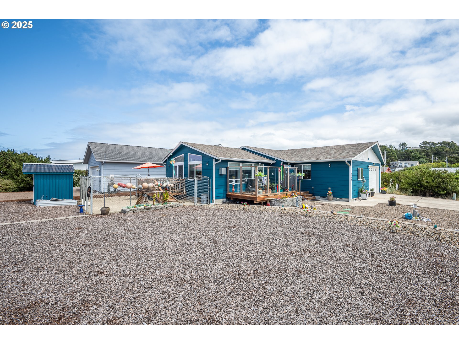 1602 Northwest Oceanic Loop Waldport, OR 97394 - Photo 3 of 47 a view of a house with backyard and sitting area