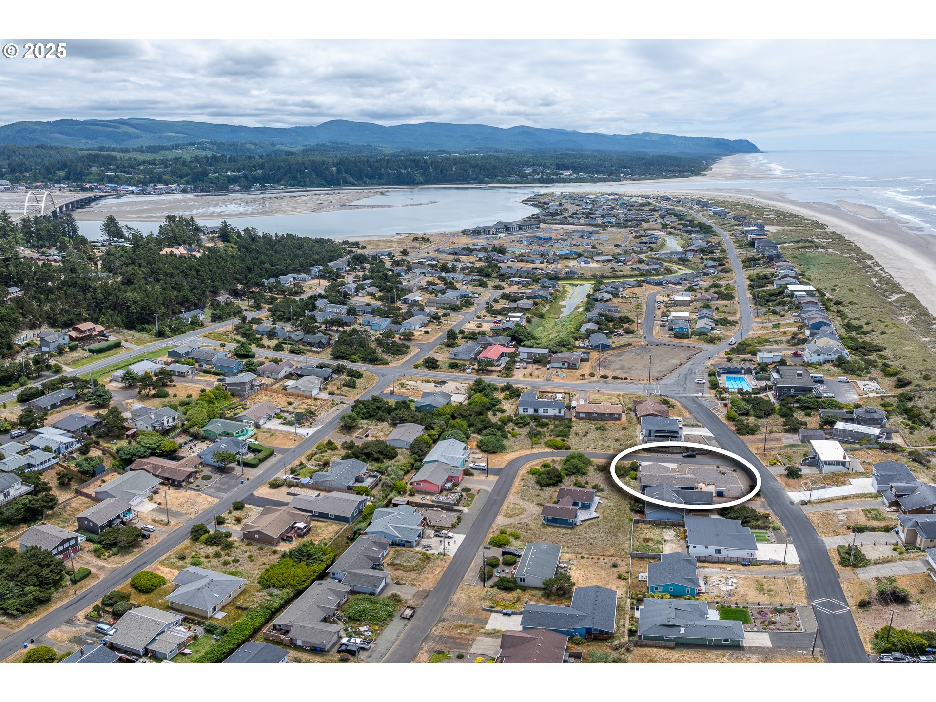 1602 Northwest Oceanic Loop Waldport, OR 97394 - Photo 35 of 47 an aerial view of a house with a lake view