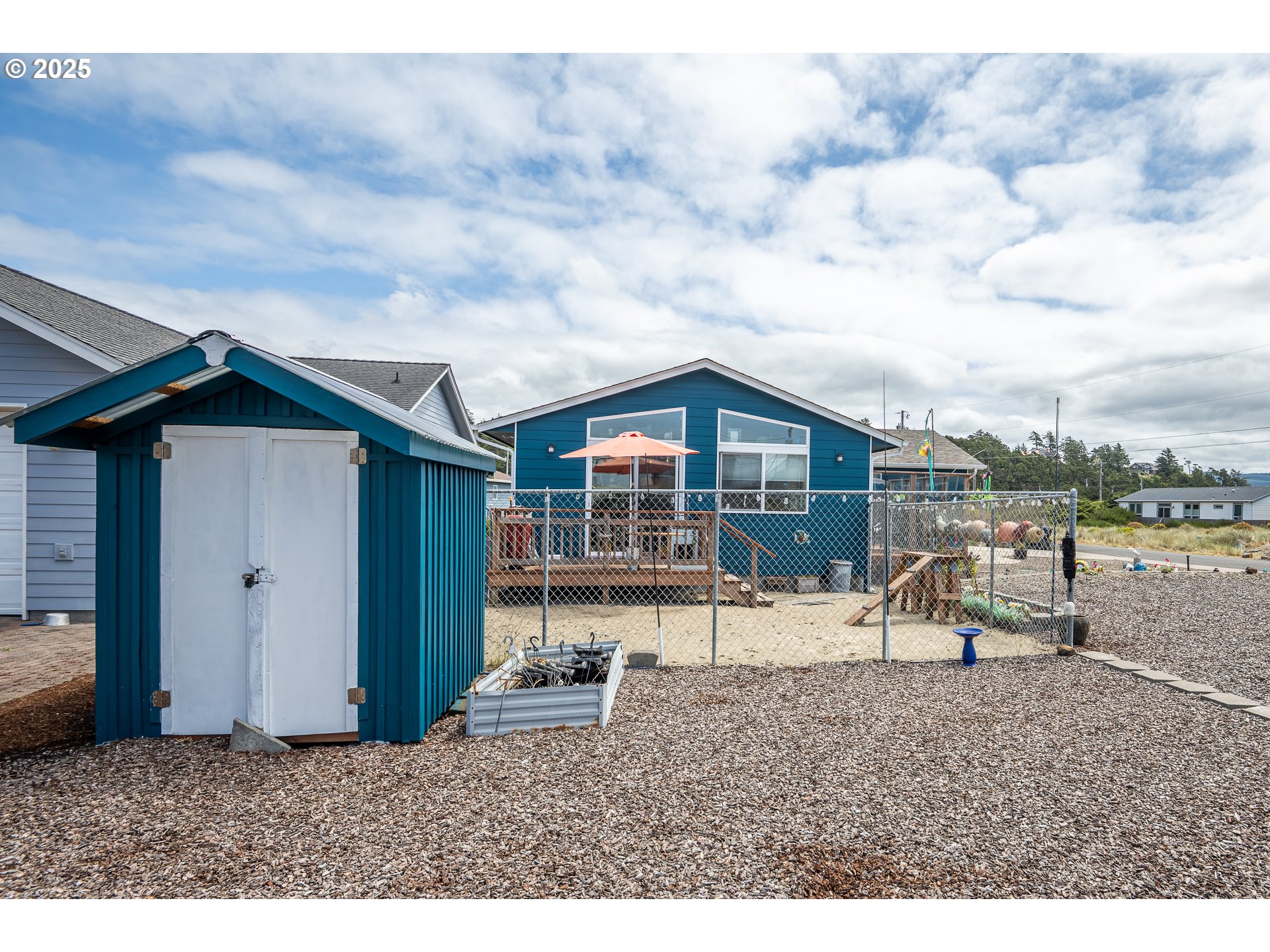 1602 Northwest Oceanic Loop Waldport, OR 97394 - Photo 40 of 47 a view of a house with a backyard