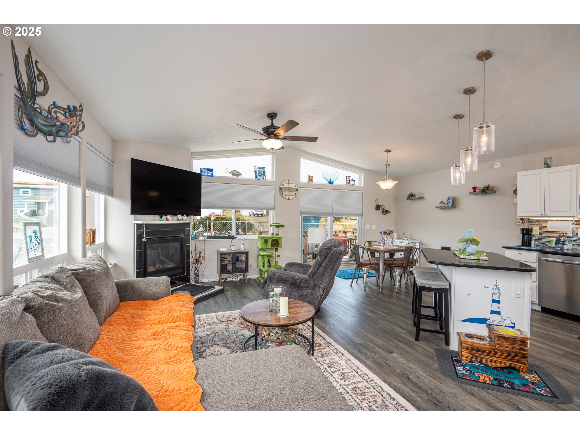 1602 Northwest Oceanic Loop Waldport, OR 97394 - Photo 5 of 47 a living room with furniture and a flat screen tv