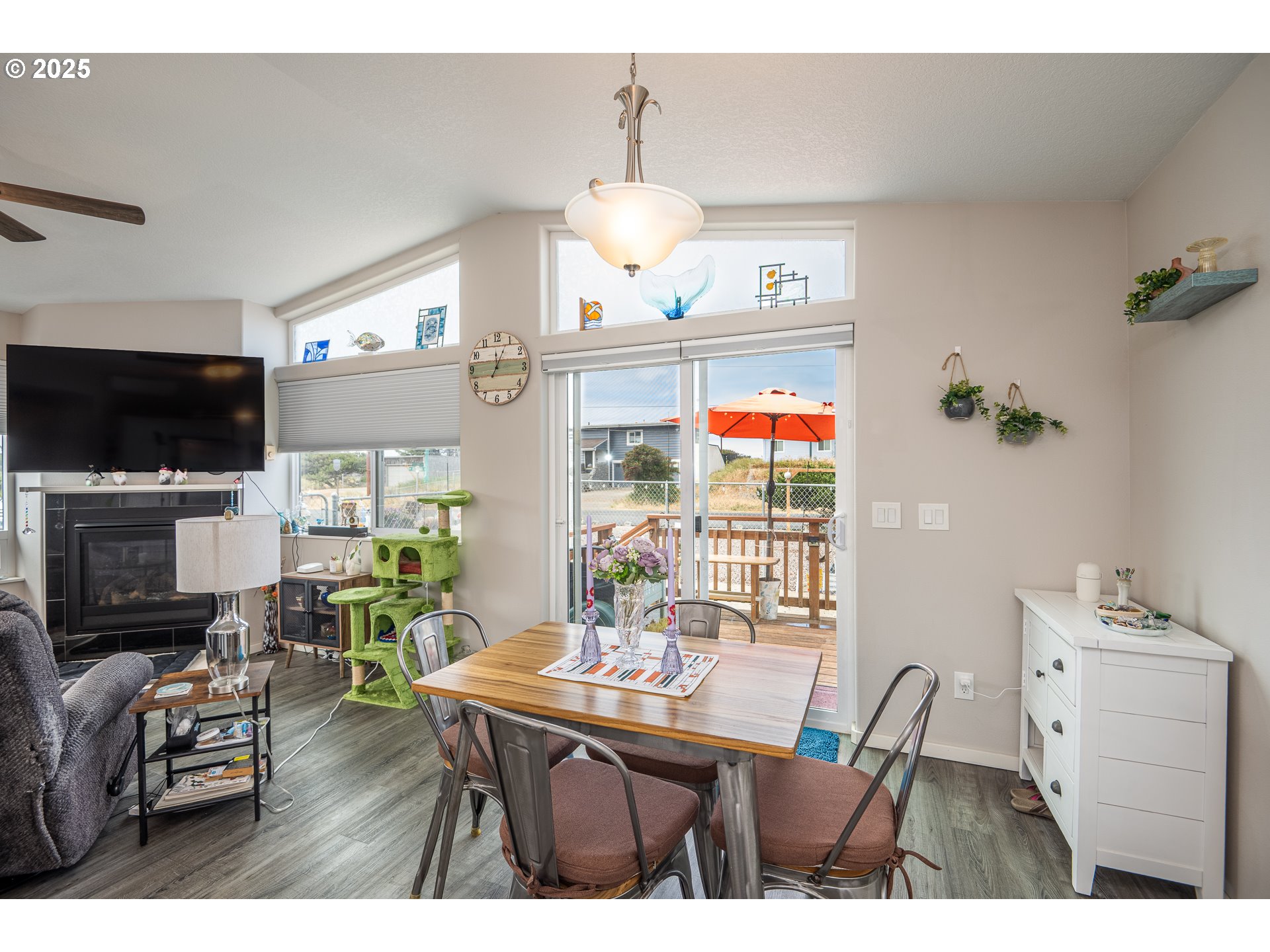 1602 Northwest Oceanic Loop Waldport, OR 97394 - Photo 8 of 47 a view of a dining room with furniture window and wooden floor