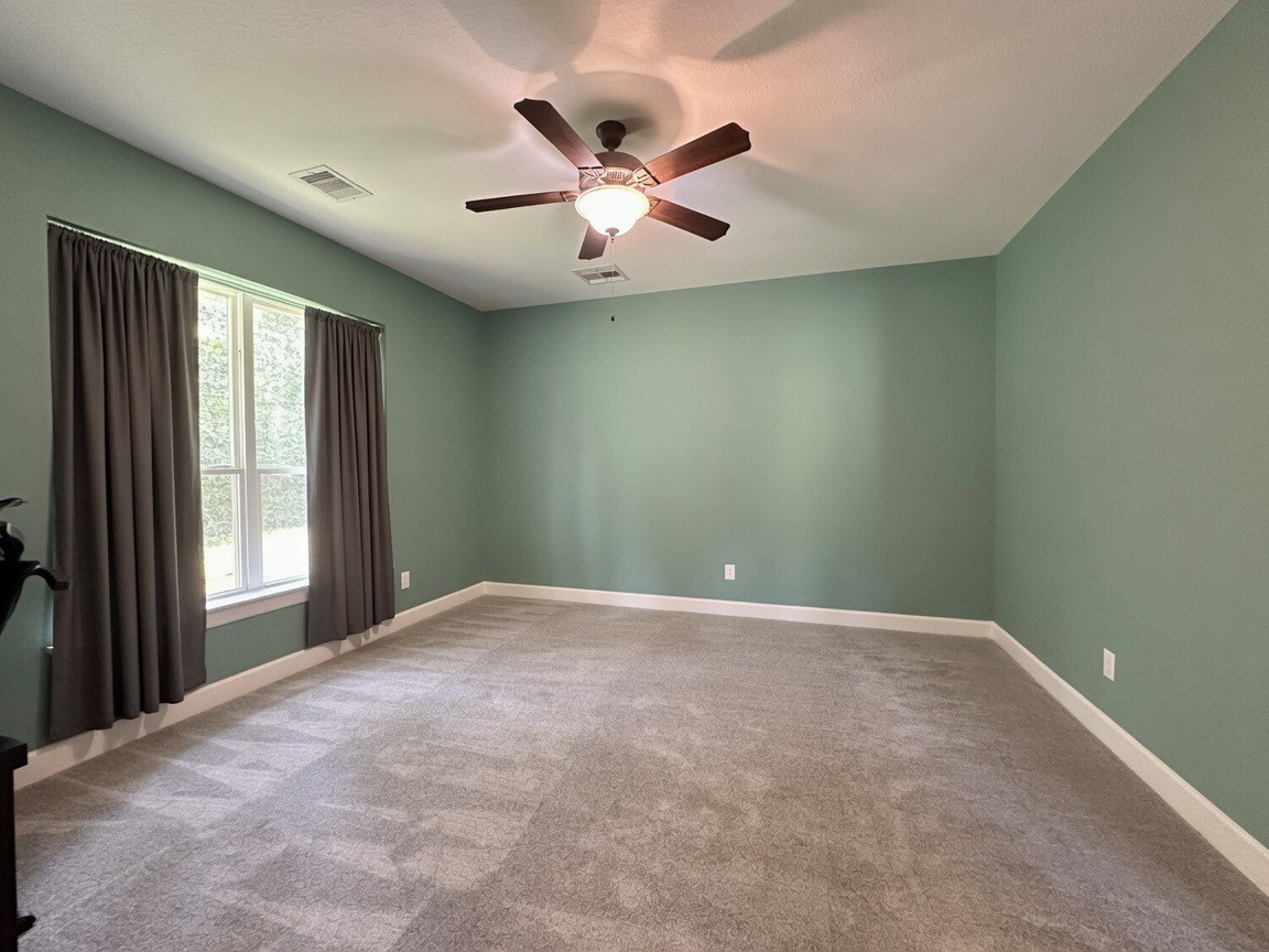 1145 Goodson Loop Pinehurst, TX 77362 - Photo 15 of 47 Second Bedroom