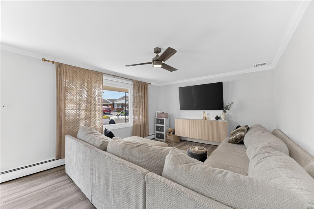 7290 Heather Road Macungie, PA 18062 - Photo 11 of 39 Relax in this inviting living room featuring durable wood flooring and ample natural light.