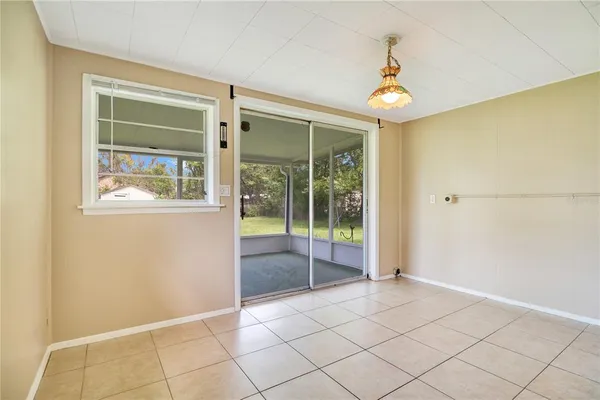 a view of an empty room with glass door
