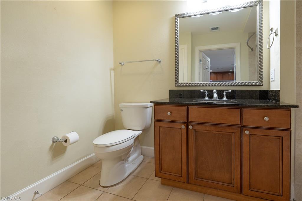 1362 Centre Ct Ridge Drive, Unit 101 Reunion, FL 34747 - Photo 8 of 25 Bathroom featuring tile flooring, toilet, and vanity