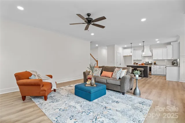 a living room with furniture fireplace and window