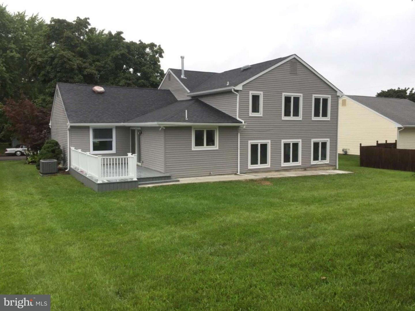 103 Greenbriar Road Delran, NJ 08075 - Photo 4 of 18 a front view of a house with a garden