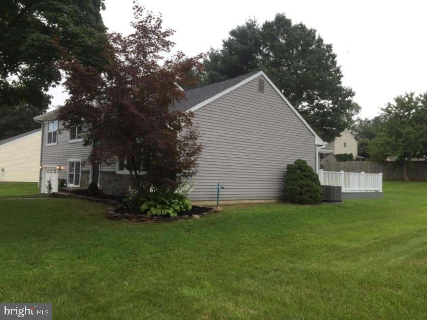 103 Greenbriar Road Delran, NJ 08075 - Photo 5 of 18 a view of a house with a yard
