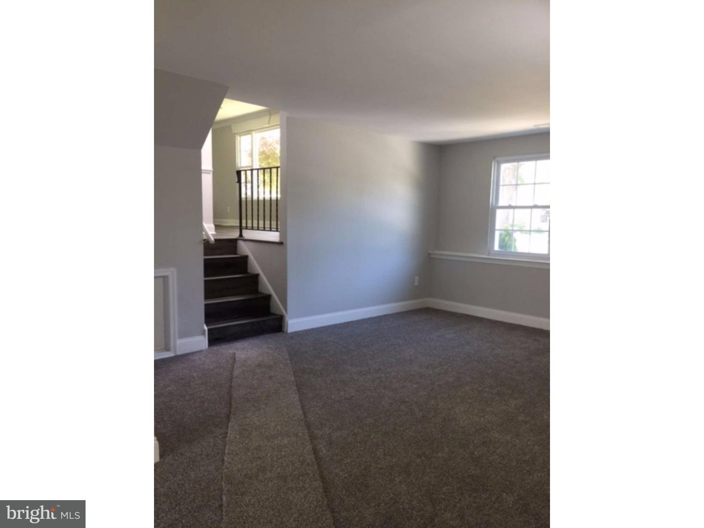 103 Greenbriar Road Delran, NJ 08075 - Photo 7 of 18 a view of an empty room with wooden floor and a window
