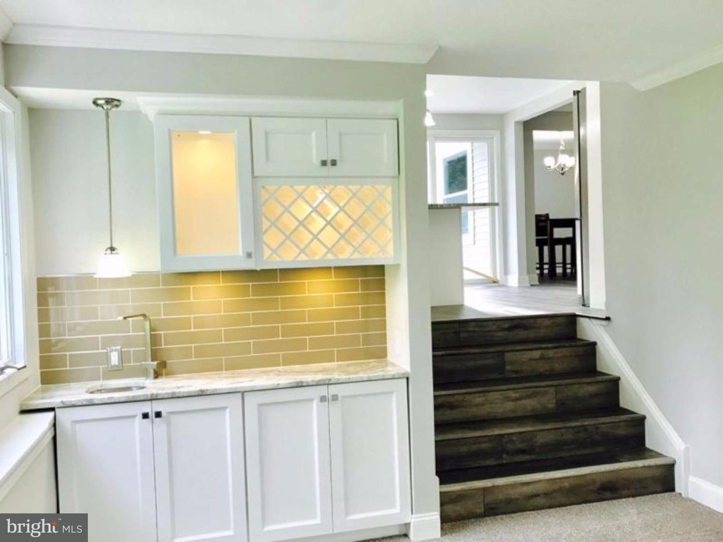 103 Greenbriar Road Delran, NJ 08075 - Photo 9 of 18 a view of a kitchen with wooden floor and staircase