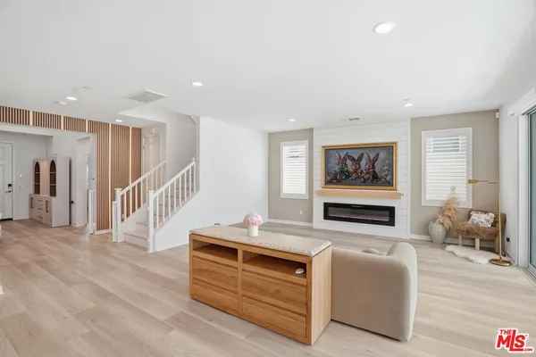 a large kitchen with kitchen island a dining table and chairs