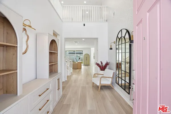 a view of front door with wooden floor