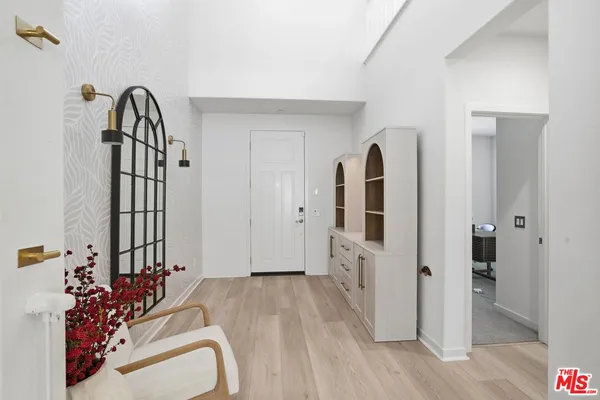 a view of living room with furniture and flat screen tv