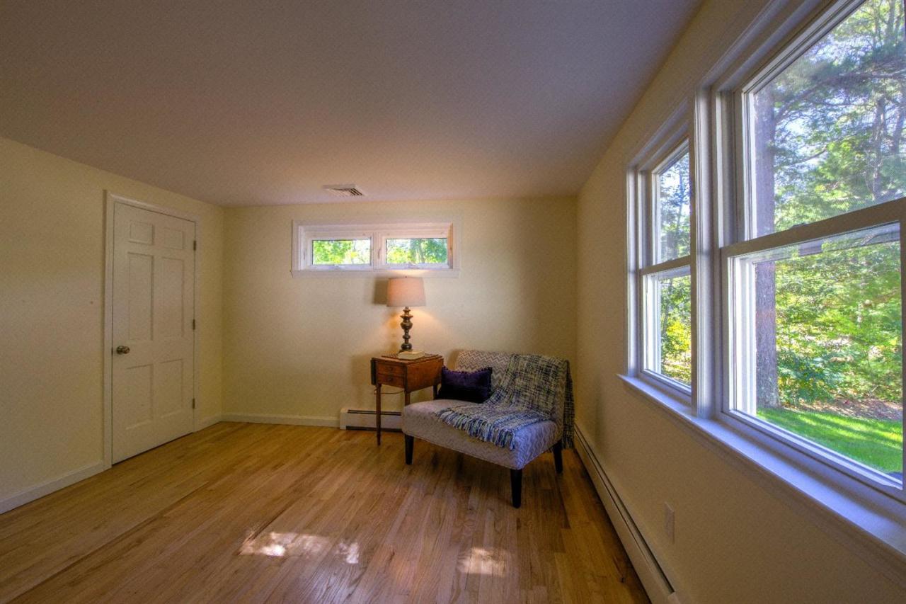 90 Ralyn Road Cotuit, MA 02635 - Photo 15 of 29 a living room with furniture and a window