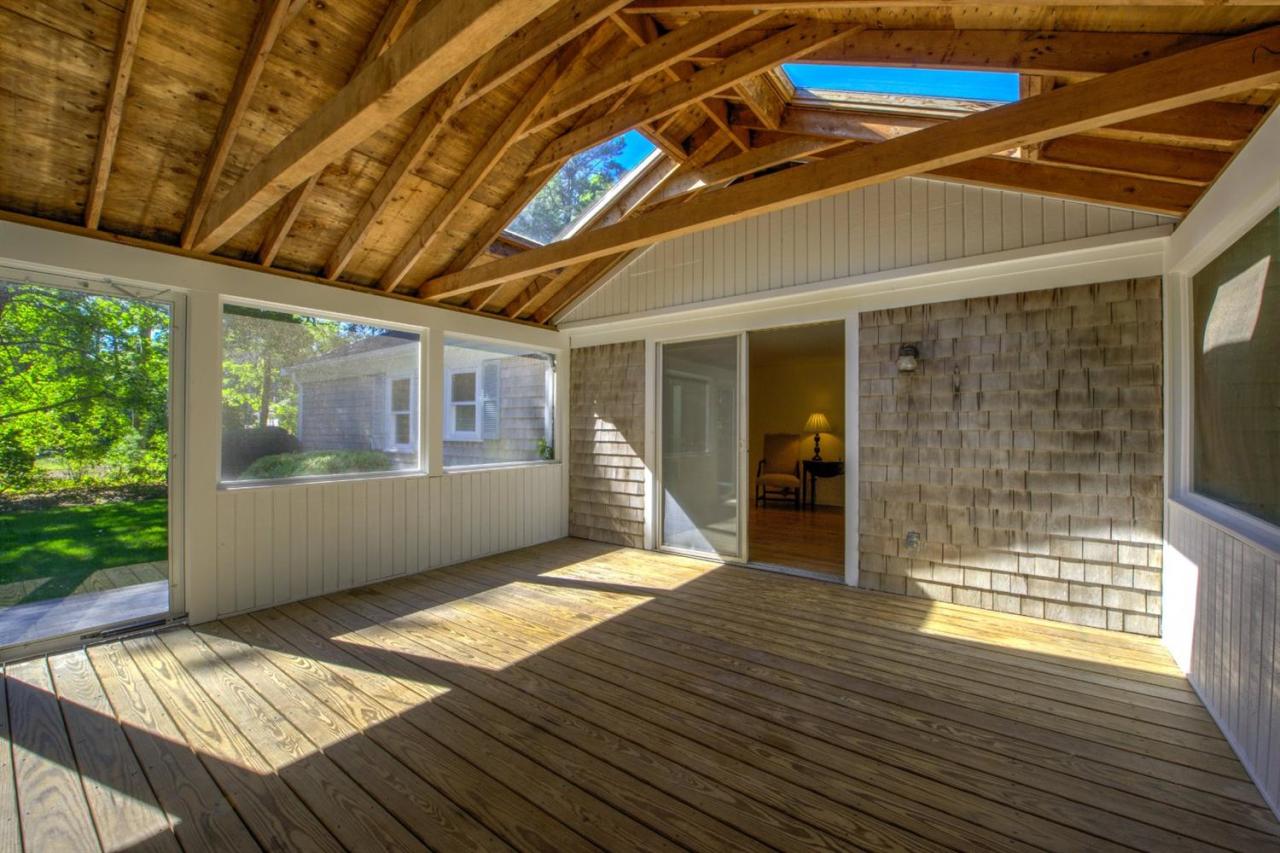 90 Ralyn Road Cotuit, MA 02635 - Photo 20 of 29 a front view of a house with a outdoor space