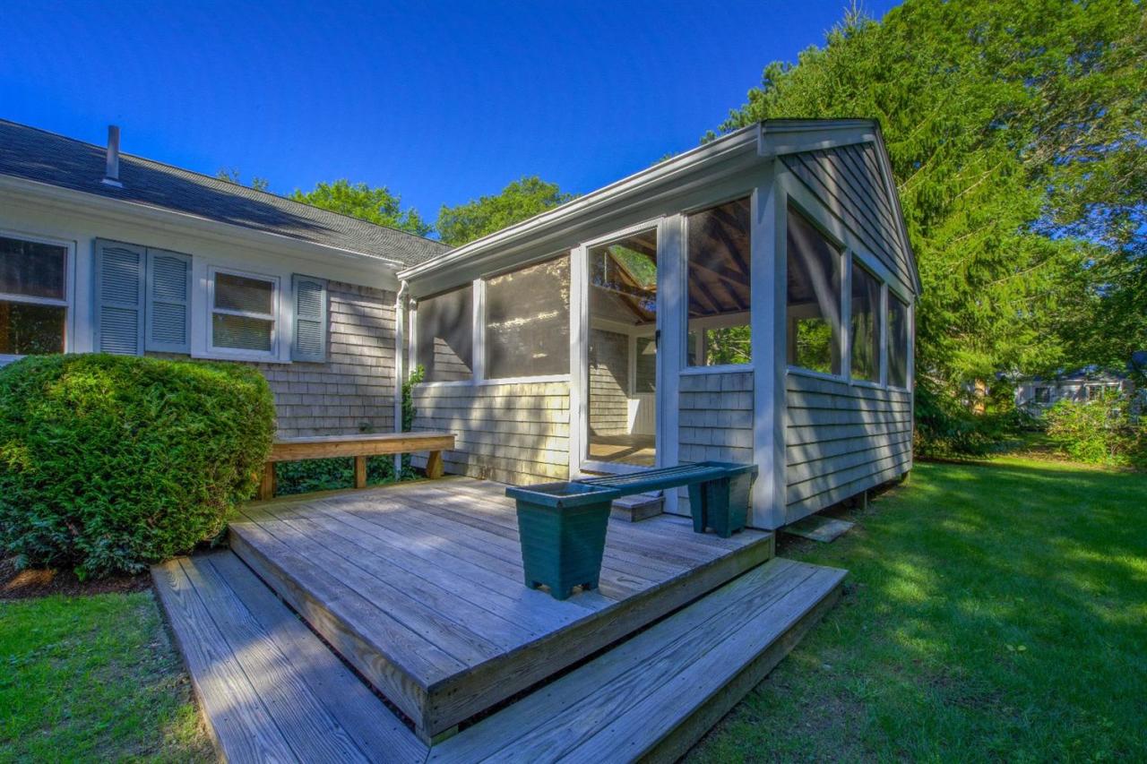 90 Ralyn Road Cotuit, MA 02635 - Photo 21 of 29 a view of house with backyard outdoor seating