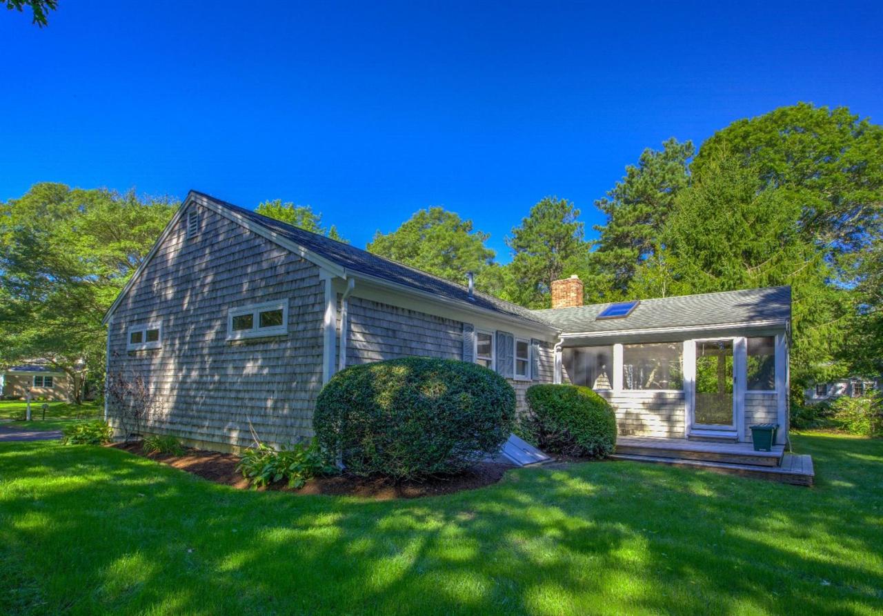 90 Ralyn Road Cotuit, MA 02635 - Photo 22 of 29 a view of house with a yard