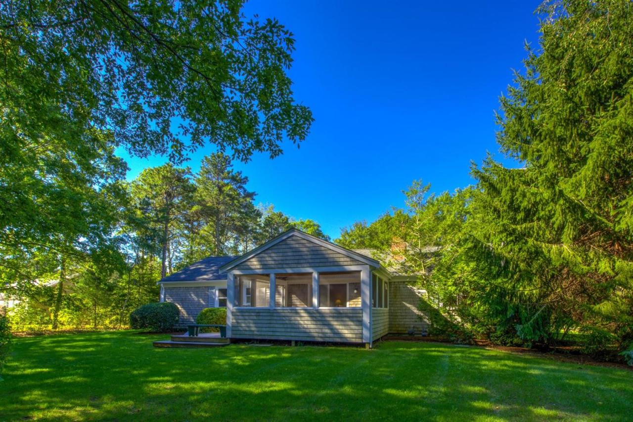 90 Ralyn Road Cotuit, MA 02635 - Photo 23 of 29 a view of a house with a yard and sitting area