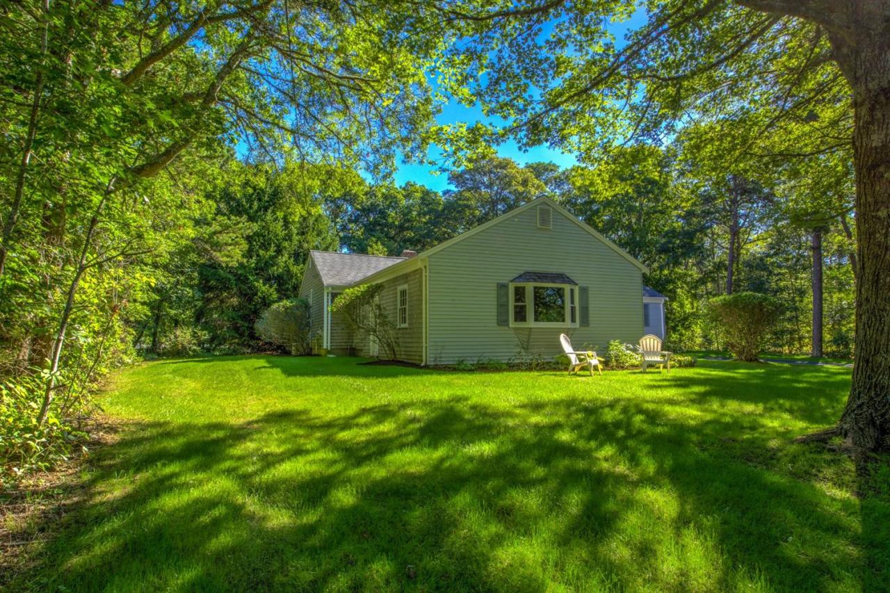 90 Ralyn Road Cotuit, MA 02635 - Photo 25 of 29 a house that is sitting in the grass