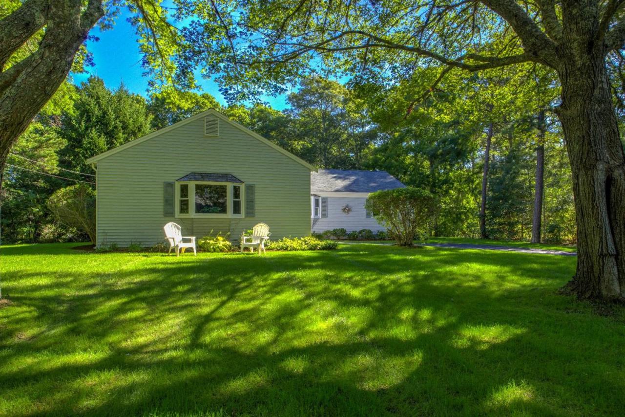 90 Ralyn Road Cotuit, MA 02635 - Photo 26 of 29 a front view of house with yard and green space