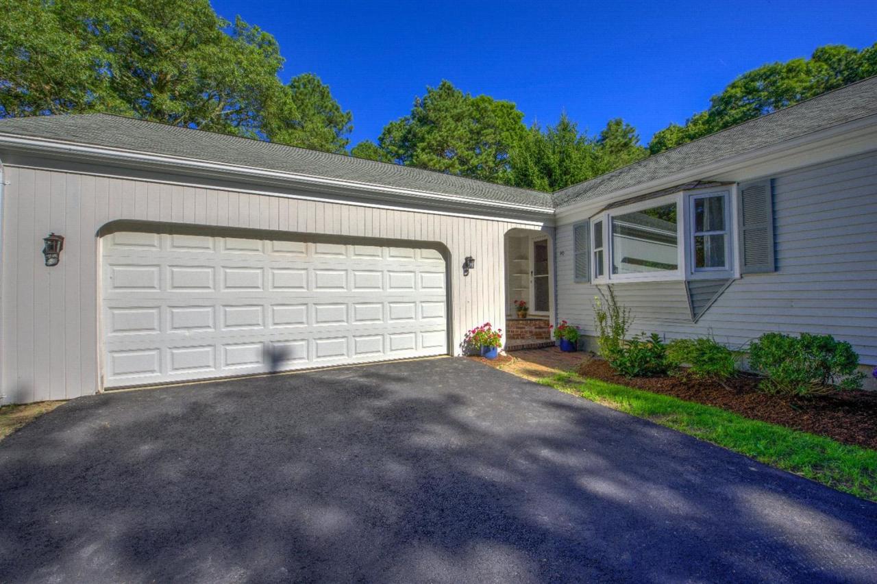 90 Ralyn Road Cotuit, MA 02635 - Photo 28 of 29 a view of backyard of house with green space