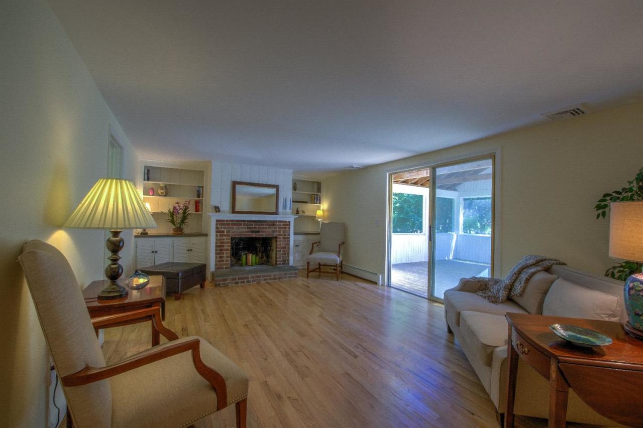 90 Ralyn Road Cotuit, MA 02635 - Photo 3 of 29 a living room with furniture or fireplace and a flat screen tv