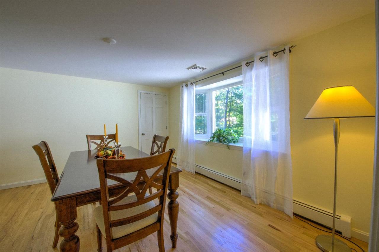 90 Ralyn Road Cotuit, MA 02635 - Photo 9 of 29 a dining room with furniture and window