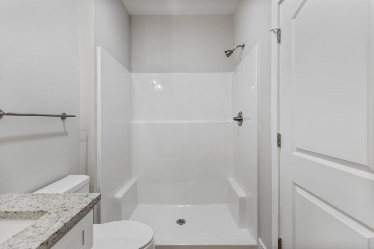 129 County Road 155 Riceville, TN 37370 - Photo 23 of 31 a bathroom with a granite countertop sink toilet and shower