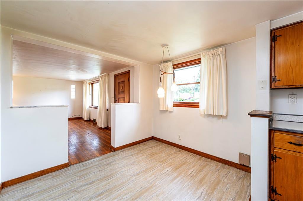 13740 Ridge Road Irwin, PA 15642 - Photo 9 of 43 a view of empty room with wooden floor and fan