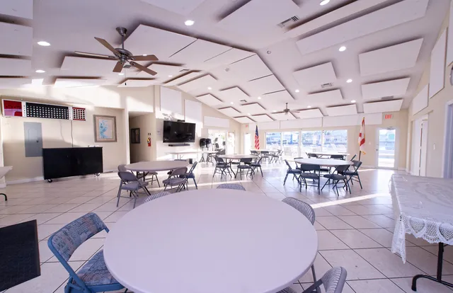 a kitchen with granite countertop a sink stove and microwave