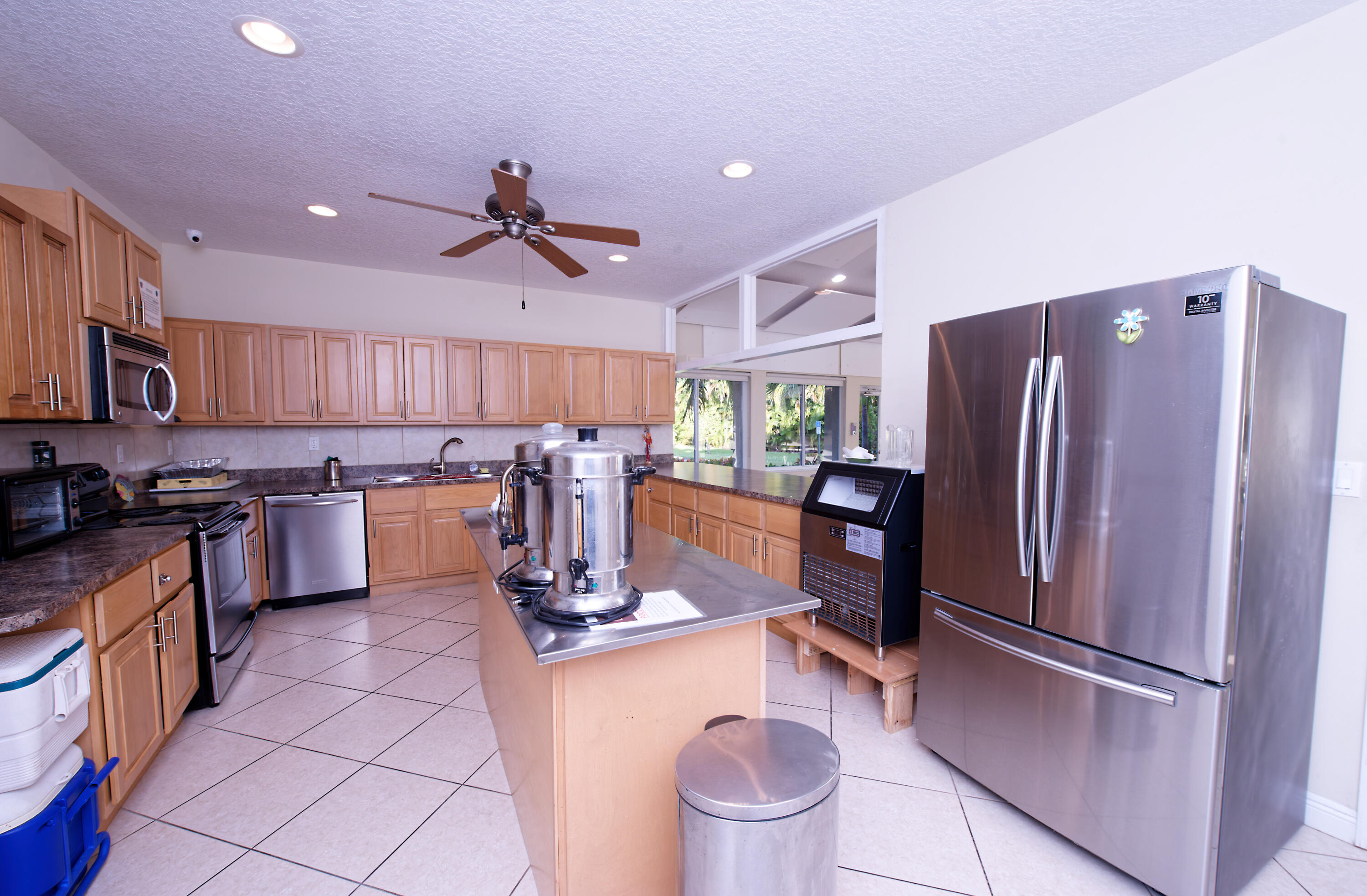 632 Snug Harbor Drive, Unit D15 Boynton Beach, FL 33435 - Photo 20 of 50 a kitchen with refrigerator a stove and cabinets