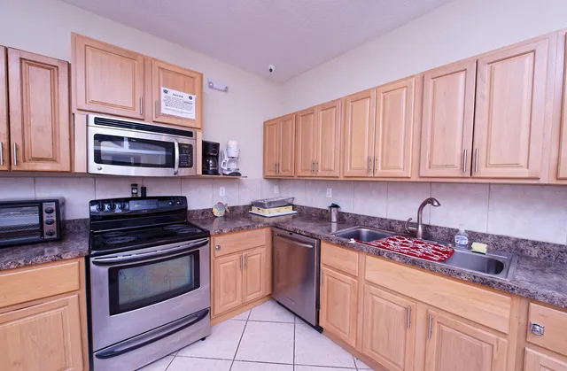 a view of a livingroom with furniture and a flat screen tv