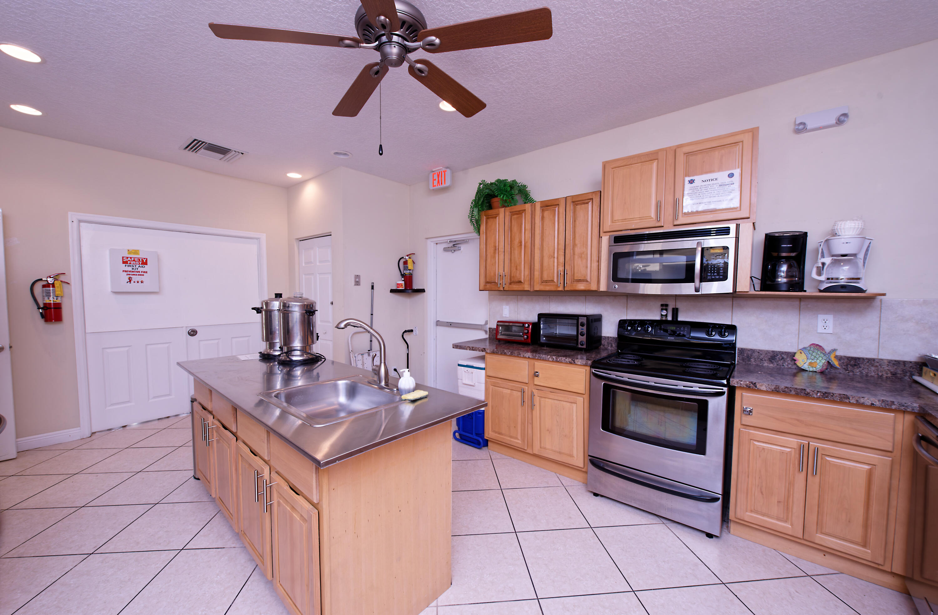 632 Snug Harbor Drive, Unit D15 Boynton Beach, FL 33435 - Photo 23 of 50 a kitchen with stainless steel appliances granite countertop a sink and a stove