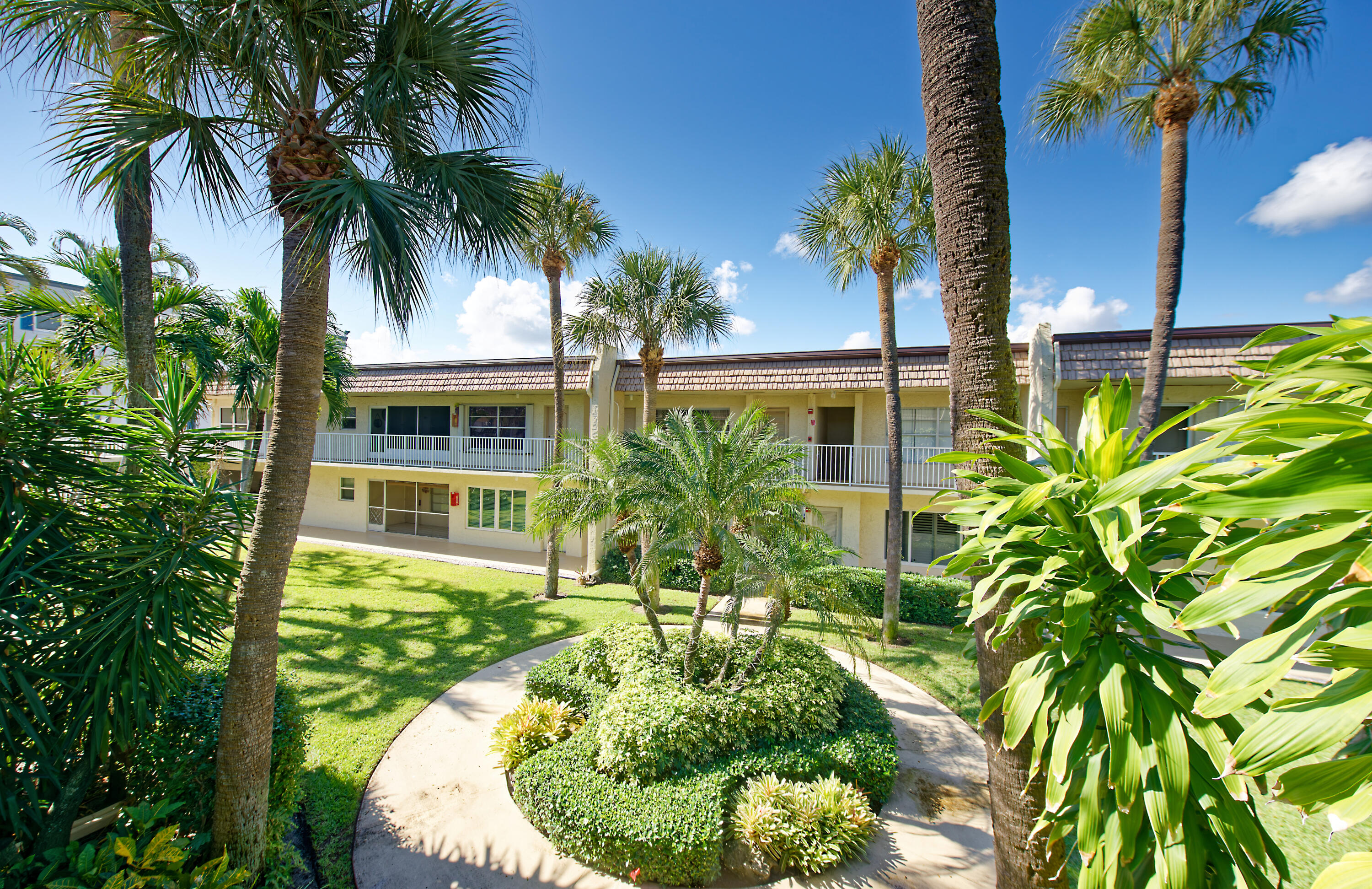 632 Snug Harbor Drive, Unit D15 Boynton Beach, FL 33435 - Photo 32 of 50 a house with palm tree in front of it
