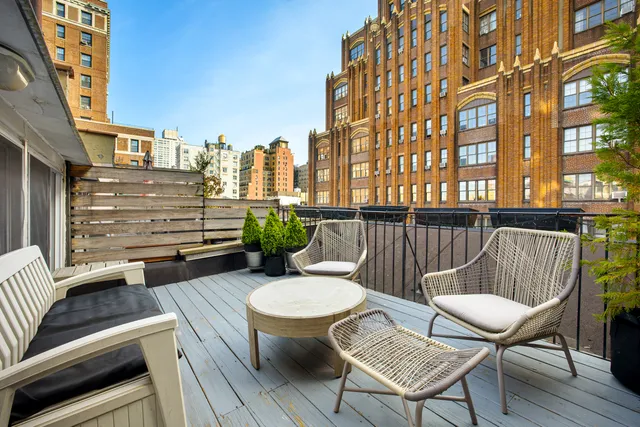a view of a balcony with chairs