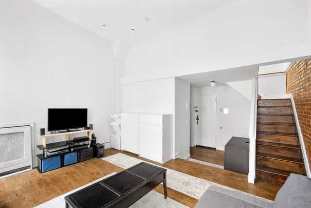 a kitchen with stainless steel appliances a stove and a microwave