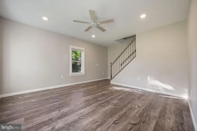 a view of an entryway with wooden floor